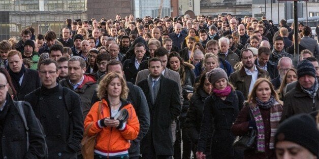 Crowds of commuters on London Bridge this morning.