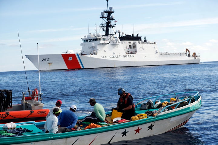 Coast Guard officers board a small fishing boat accused of smuggling cocaine in the Pacific Ocean in February 2017.