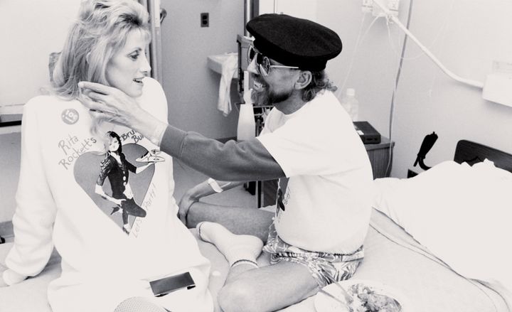 AIDS caregiver Rita Rockett with a patient in "5B."