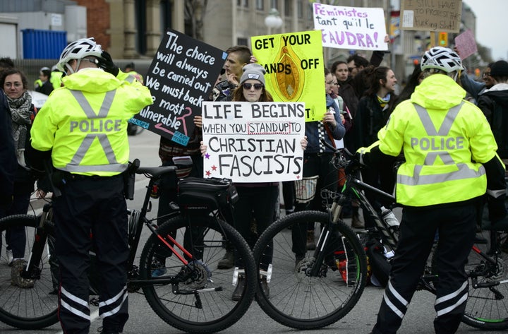 Pro-Choice supporters rally on the sidelines as people take part in the March For Life rally on Parliament Hill in Ottawa on May 9, 2019.