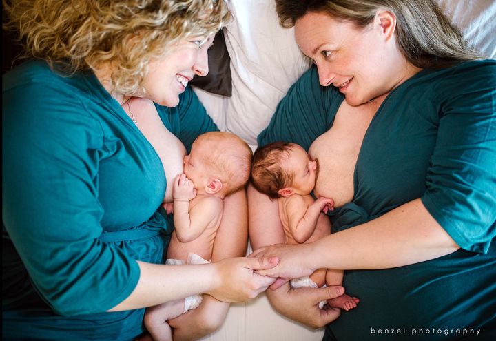 Jaclyn and Kelly Pfeiffer breastfeed their newborn twins in this powerful image by Melissa Benzel.