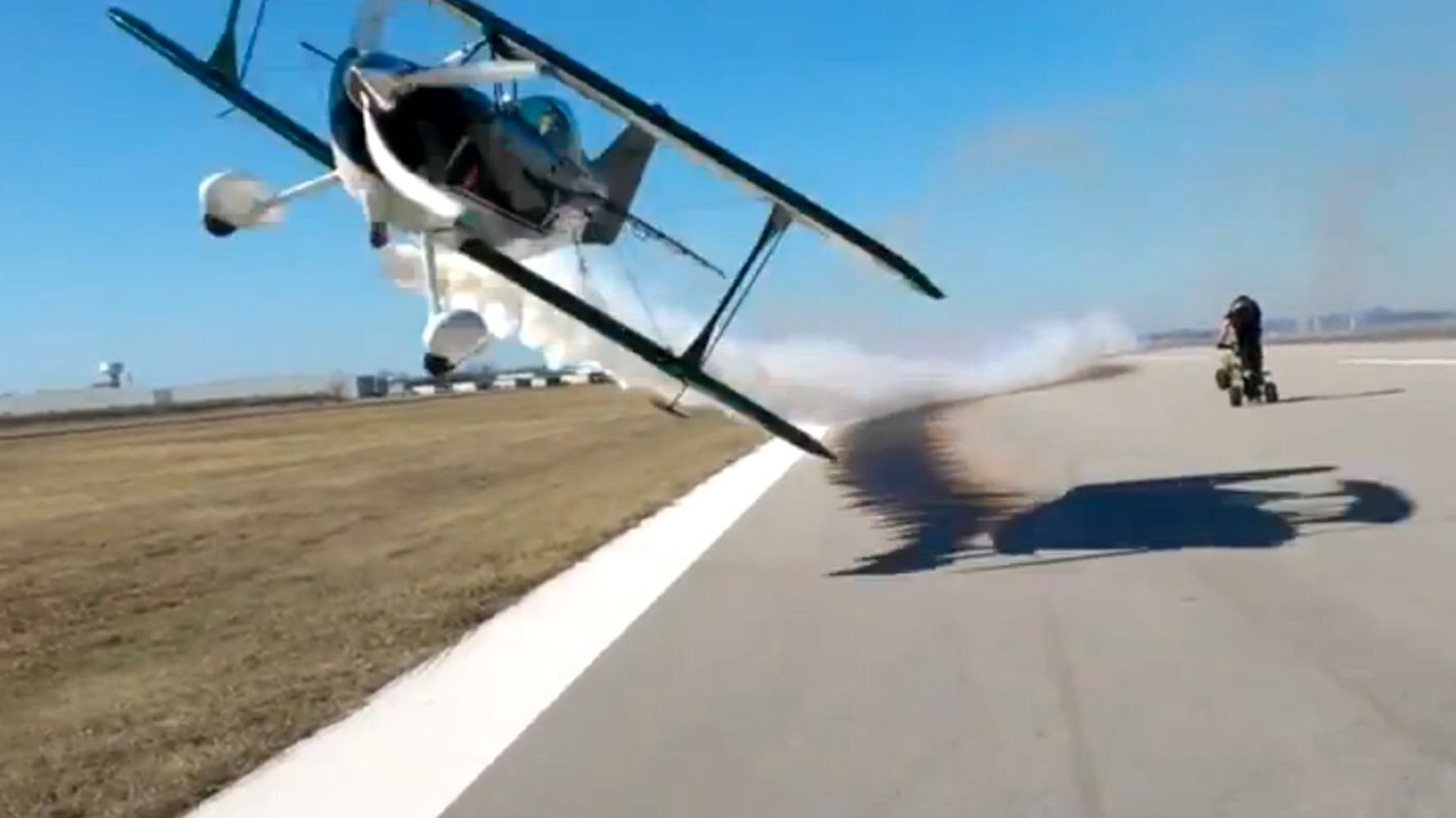 Crazy Bi-Plane Stunt Sees Aircraft Fly Within Feet Of Cameraman On ...