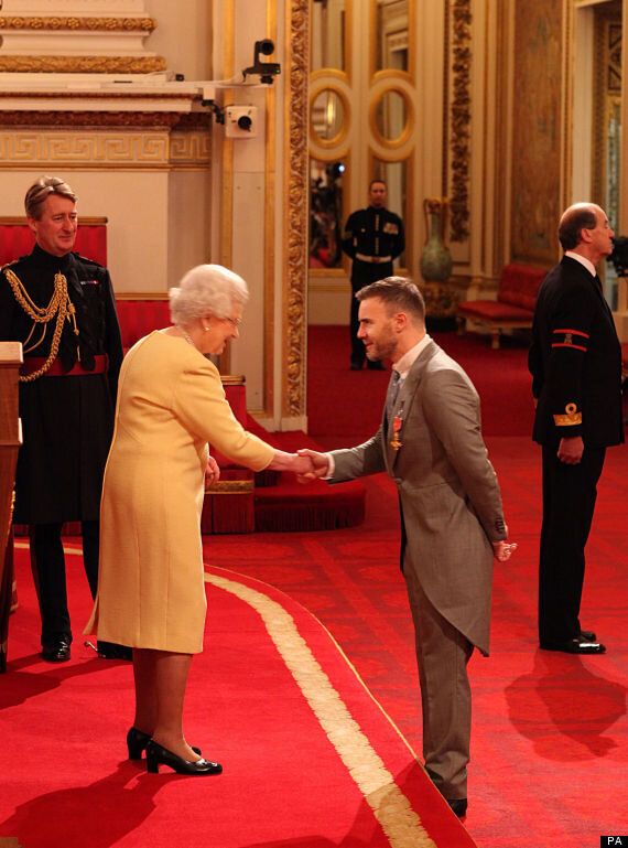 Gary Barlow returns to Buckingham Palace to receive OBE 