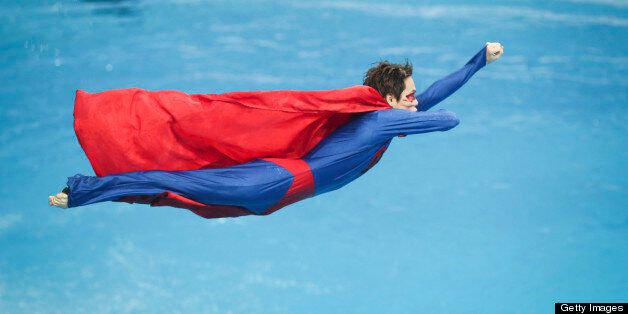 BEIJING, CHINA - MARCH 15: (CHINA OUT) A diver dressed as Superman performs during day one of the FINA Diving World Series Beijing Station at the National Aquatics Center on March 15, 2013 in Beijing, China. (Photo by ChinaFotoPress/Getty Images)