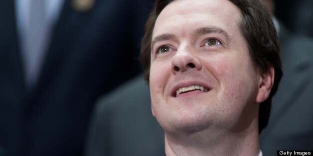 British Cancellor of the Exchequer George Osborne smiles before a family photo of finance ministers and central bank governors following the G20 meeting at the 2013 World Bank/IMF Spring meetings in Washington on April 19, 2013. AFP PHOTO/Nicholas KAMM (Photo credit should read NICHOLAS KAMM/AFP/Getty Images)