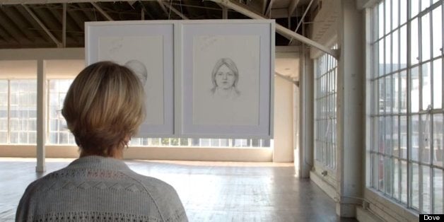 A woman looks at an artist's impressions of her in Dove 'Real Beauty Sketches' Video