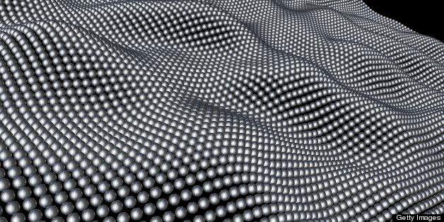 Computer artwork of nanospheres forming a layer, depicting a graphene sheet. Graphene is very strong and flexible. It transports electrons highly efficiently and may one day replace silicon in computer chips and other technology applications. The 2010 Nobel Prize for Physics was awarded to Andre Geim and Konstantin Novoselov for their work on graphene sheets.