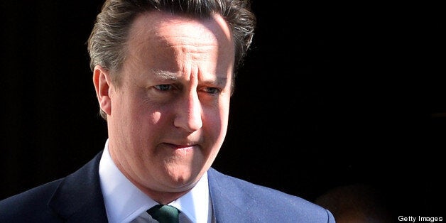 British Prime Minister David Cameron leaves 10 Downing street in central London on April 24, 2013, to attend the weekly Prime Minister's Questions (PMQs) at the House of Commons. AFP PHOTO / BEN STANSALL (Photo credit should read BEN STANSALL/AFP/Getty Images)