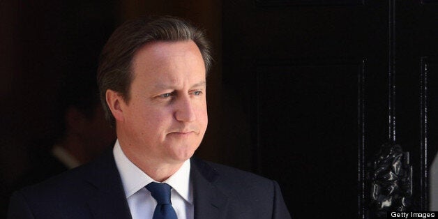 LONDON, ENGLAND - MAY 01: British Prime Minister David Cameron waits to greet the President of the United Arab Emirates, His Highness Sheikh Khalifa bin Zayed Al Nahyan, in Downing Street on May 1, 2013 in London, England. The President of the United Arab Emirates is paying a two-day State Visit to the United Kingdom, staying in Windsor Castle as the guest of Her Majesty The Queen from April 30, 2013 to May 1, 2013. (Photo by Oli Scarff/Getty Images)