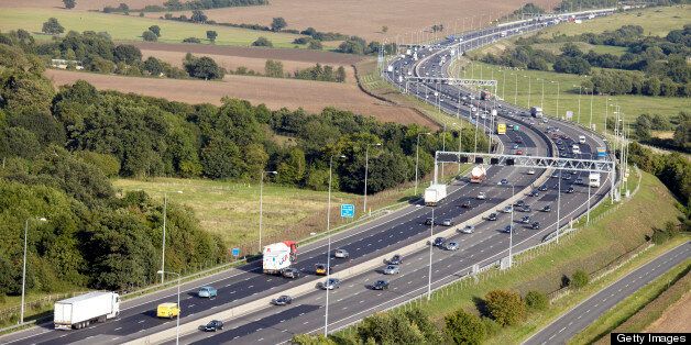 Aerial Photography view east of traffic on M25 Motorway highway north of Stapleford Essex RM4, England UK