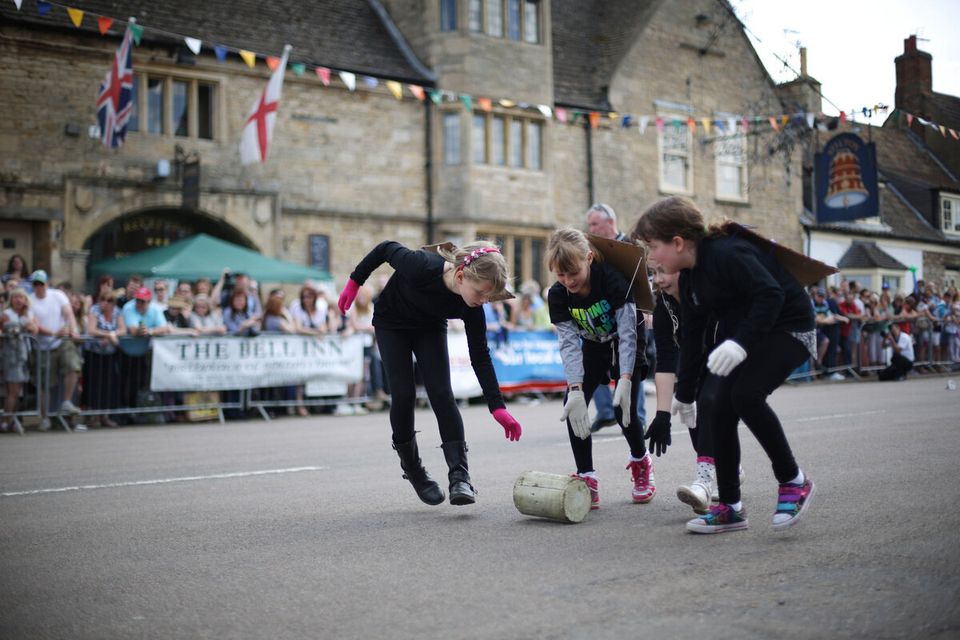Participants Take Part In The Annual Stilton Cheese Rolling Competition