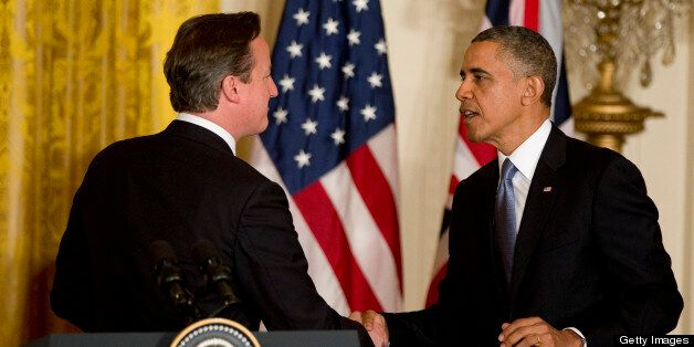U.S. President Barack Obama, right, shakes hands with David Cameron, U.K. prime minister, during a news conference in the East Room of the White House in Washington, D.C., U.S., on Monday, May 13, 2013. President Barack Obama said his administration made no attempt to cover up or downplay the involvement of terrorists in last year's deadly attack on a U.S. outpost in Benghazi, Libya, and said the congressional investigation has turned into a 'political circus.' Photographer: Andrew Harrer/Bloomberg via Getty Images