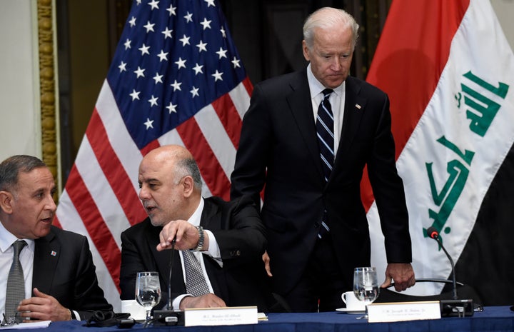 Biden arriving at an event with then-Iraqi Prime Minister Haider al-Abadi (second from left), whom the U.S. scrambled to help form a government after Maliki's controversial reign.