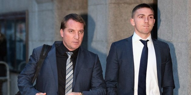 LONDON, ENGLAND - FEBRUARY 07: Brighton And Hove Albion football player Anton Rodgers (R), 19, leaves the Old Bailey with his father Brendan Rodgers, manager of Liverpool FC, on February 7, 2013 in London, England. A jury at the Old Bailey has failed to reach a verdict in the case of four footballers accused of sexual assault. Three Brighton And Hove Albion footballers and a player from AFC Bournemouth had faced trial accused of sexual assault and voyeurism. The offences are alleged to have taken place at the Jury's Inn Hotel in Brighton, in July 2011. (Photo by Oli Scarff/Getty Images)