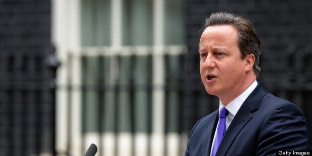 Britian's prime Minister David Cameron arrives to address media representatives at 10 Downing Street in London on May 23, 2013, a day after a soldier who was hacked to death in a London street by two suspected Islamist extremists. Britain's national security chiefs met as counter-terrorism police investigated the murder of a soldier who was hacked to death in a London street by two suspected Islamist extremists. The suspects were shot by police after the gruesome attack and spent the night in separate hospitals under armed guard. AFP PHOTO/LEON NEAL (Photo credit should read LEON NEAL/AFP/Getty Images)