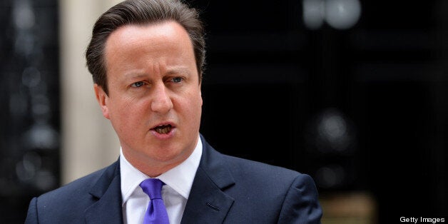 Britian's prime Minister David Cameron addresses media representatives at 10 Downing Street in London on May 23, 2013, a day after a soldier who was hacked to death in a London street by two suspected Islamist extremists. Britain's national security chiefs met as counter-terrorism police investigated the murder of a soldier who was hacked to death in a London street by two suspected Islamist extremists. The suspects were shot by police after the gruesome attack and spent the night in separate hospitals under armed guard. (Photo credit should read LEON NEAL/AFP/Getty Images)