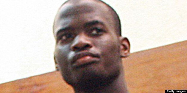 (FILES) This photo taken on November 23, 2010 shows Michael Adebolajo among the nine suspected members of the Al-Shabaab Movement (unpictured) arrested by Kenyan police on November 22 on claims of being Al-Shabaab recruits on their way to Somalia at the weekend. Michael Adebolajo, one of the main suspects in the brutal murder of a soldier in London, was arrested in Kenya more than two years ago for seeking terror training, it emerged on May 26, 2013, after police made more arrests. The reports said Adebolajo, 28, had been accused of trying to lead a group of youths trying to join Somalia's Al-Qaeda-linked Shebab movement. The disclosure raises fresh questions about the monitoring of Adebolajo and the other suspect in the murder, 22-year-old Michael Adebowale, by Britain's intelligence services. AFP PHOTO / MICHAEL RICHARDS (Photo credit should read MICHAEL RICHARDS/AFP/Getty Images)