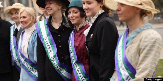 Campaigners dressed as suffragettes attend a rally organised by UK Feminista to call for equal rights for men and women