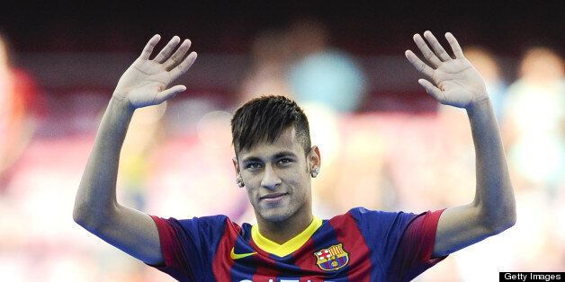 BARCELONA, SPAIN - JUNE 03: Neymar waves to the crowd during the official presentation as a new player of the FC Barcelona at Camp Nou Stadium on June 3, 2013 in Barcelona, Spain. (Photo by David Ramos/Getty Images)