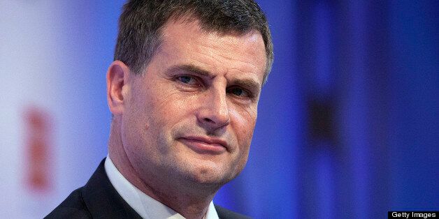 Ronan Dunne, chief executive officer of Telefonica SA's U.K. unit, listens to a speaker during the Confederation of British Industry (CBI) annual conference at the Grosvenor House hotel in London, U.K., on Monday, Nov. 19, 2012. U.K. Prime Minister David Cameron said he plans to make it harder to apply for judge-led reviews of government decisions in the U.K., arguing the current system and other red tape are holding back projects needed to boost growth. Photographer: Simon Dawson/Bloomberg via Getty Images