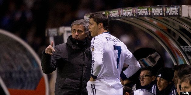 LA CORUNA, SPAIN - FEBRUARY 23: Head coach Jose Mourinho (L) of Real Madrid CF gives instructions to Cristiano Ronaldo (2ndl) on the desk during the La Liga match between RC Deportivo La Coruna and Real Madrid CF at Riazor Stadium on February 23, 2013 in La Coruna, Spain. (Photo by Gonzalo Arroyo Moreno/Getty Images)