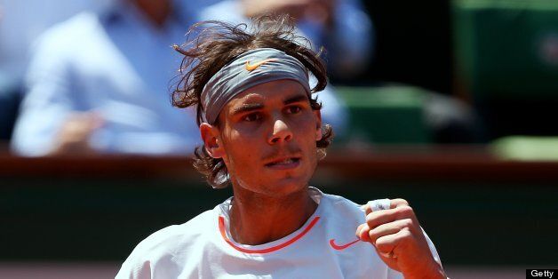 PARIS, FRANCE - JUNE 07: Rafael Nadal of Spain celebrates a point during the men's singles semi-final match against Novak Djokovic of Serbia on day thirteen of the French Open at Roland Garros on June 7, 2013 in Paris, France. (Photo by Clive Brunskill/Getty Images)