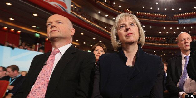 BIRMINGHAM, ENGLAND - OCTOBER 10: Foreign Secretary William Hague (L), Home Secretary Theresa May (C) and Health Secretary Jeremy Hunt (R) watch British Prime Minister David Cameron, delivers his speech to delegates on the last day of the Conservative party conference in the International Convention Centre on October 10, 2012 in Birmingham, England. In his speech to close the annual, four-day Conservative party conference, Cameron stated 'I'm not here to defend priviledge, I'm here to spread it'. (Photo by Oli Scarff/Getty Images)