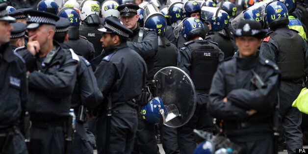 Riot police have lined the streets of central London