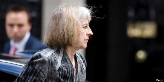 British Home Secretary Theresa May arrives to attend a meeting with government's emergency response committee, COBRA, in Downing Street in central London on May 23, 2013. Britain's national security chiefs were meeting as counter-terrorism police investigated the murder of a soldier who was hacked to death in a London street by two suspected Islamic extremists. AFP PHOTO/Leon Neal (Photo credit should read LEON NEAL/AFP/Getty Images)