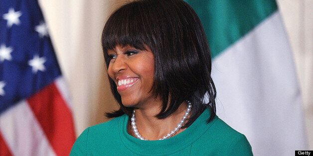 WASHINGTON, DC - MARCH 19: U.S. First lady Michelle Obama smiles during a reception for Ireland's prime minister in the East Room of the White House on March 19, 2013 in Washington, DC. President Obama met with Irish Prime Minister Enda Kenny prior to the annual St. Patrick's Day lunch hosted at the Capitol. (Photo by Olivier Douliery-Pool/Getty Images)