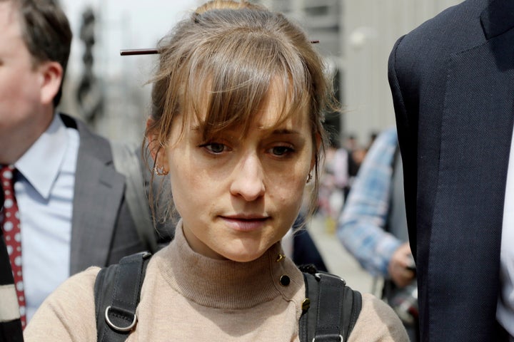 Allison Mack leaves Brooklyn federal court in New York after pleading guilty to racketeering charges in a case involving the cult-like group NXIVM based in upstate New York.