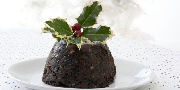 Christmas pudding with holly branch garnishing the top