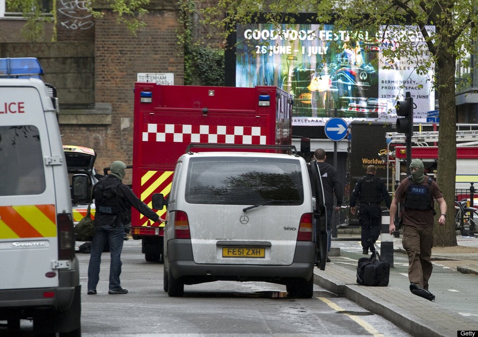 Masked police personnel leave Tottenham 