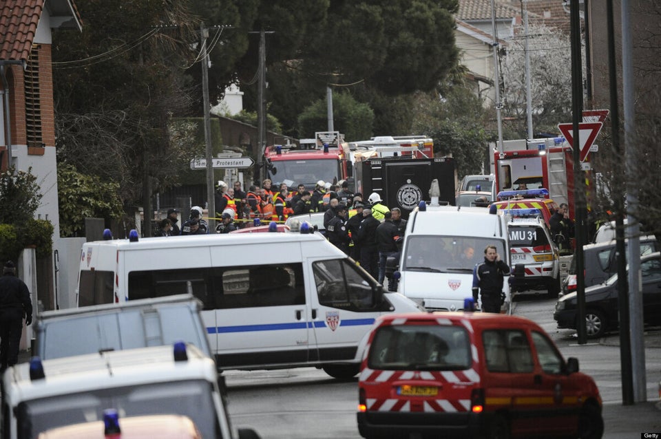 French policemen and firefighters stand