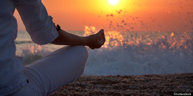 woman practicing yoga near the...