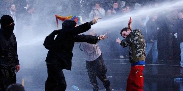 Irish police use water cannon to subdue protesters outside Phoenix Park, where the ceremony for EU enlargement took place earlier today.