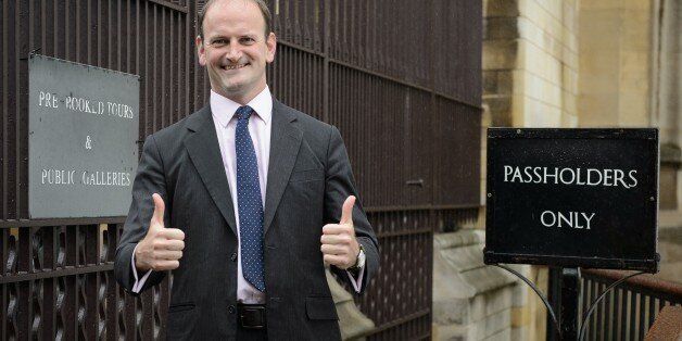 Newly elected United Kingdom Independence Party (UKIP) MP Douglas Carswell poses for pictures as he arrives at the Houses of Parliament in central London, on October 13, 2014. Britain's anti-EU UK Independence Party won its first seat in the House of Commons Friday October 10, 2014, sending jitters through Prime Minister David Cameron's Conservatives seven months before what is likely to be a tight general election. AFP PHOTO/Leon Neal (Photo credit should read LEON NEAL/AFP/Getty Images)