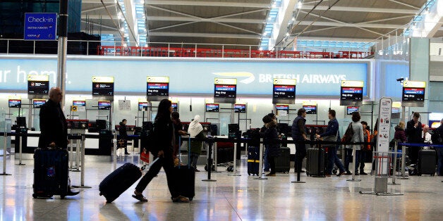 File photo showing passengers queuing to drop off their bags at Terminal 5 of Heathrow Airport