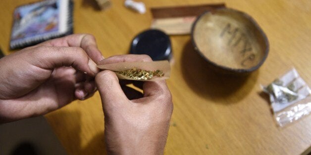 TO GO WITH AFP STORY BY DANIEL BOSQUEA member of Catalan Federation of Cannabis Association prepares a joint of marijuana in Barcelona on July 9, 2014. Hundreds of cannabis clubs in Catalonia are making Barcelona rival Amsterdam as a smoker's haven. AFP PHOTO/ LLUIS GENE (Photo credit should read LLUIS GENE/AFP/Getty Images)