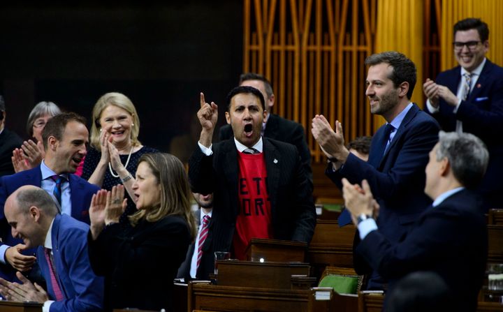 Liberal MP Arif Virani, middle, gets a Raptors chant going as he delivers a statement prior to question period in the House of Commons on Parliament Hill in Ottawa on Friday, June 14, 2019. THE CANADIAN PRESS/Sean Kilpatrick