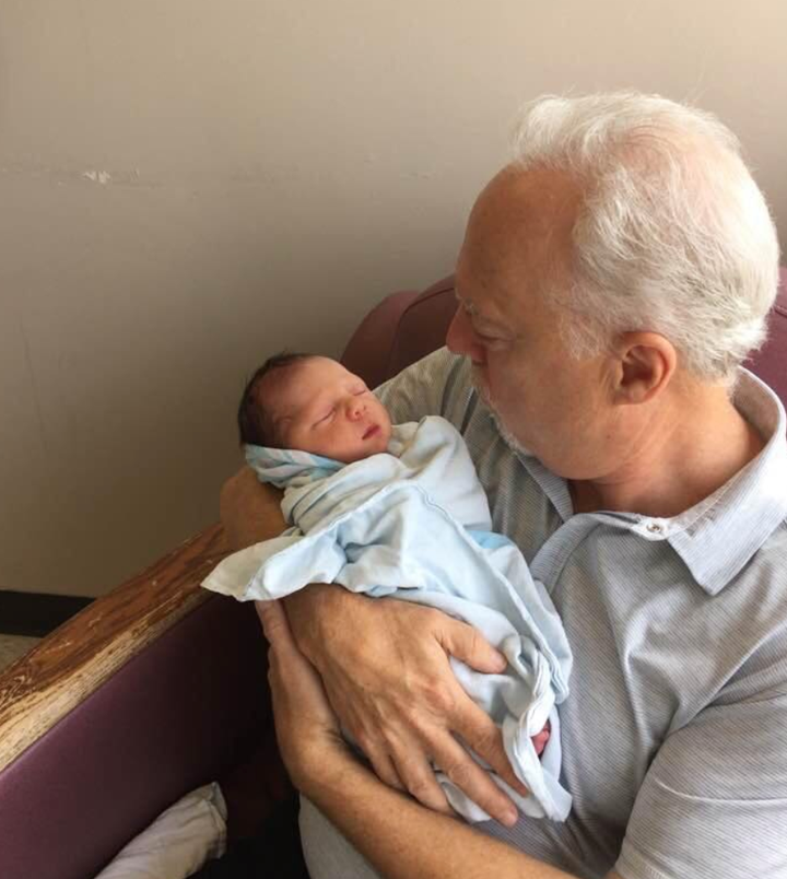 Natalie Stechyson's Doug holds her newborn son.