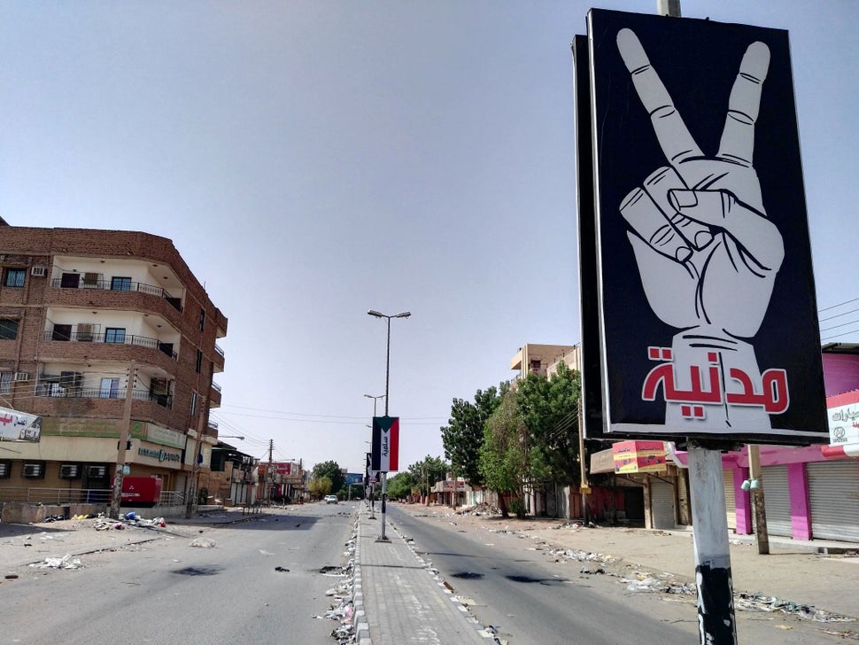 The U.S. has been slow to involve itself in the crisis, while other nations attempt to broker peace. A placard on Street 60 i