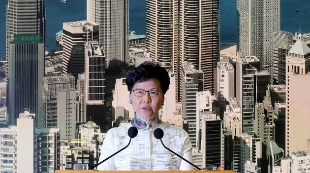 Carrie Lam announces the decision.