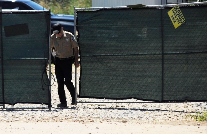 A security guard closes a gate at the construction site of a new clinic that is being built by Planned Parenthood in Birmingham, Ala., on Thursday, June 13, 2019. The organization is working on the project despite a recent law banning abortions.