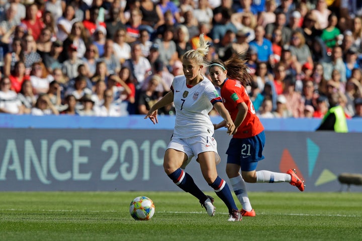 United States' Abby Dahlkemper, left, runs with the ball past Chile's Rosario Balmaceda during the Women's World Cup Group F 