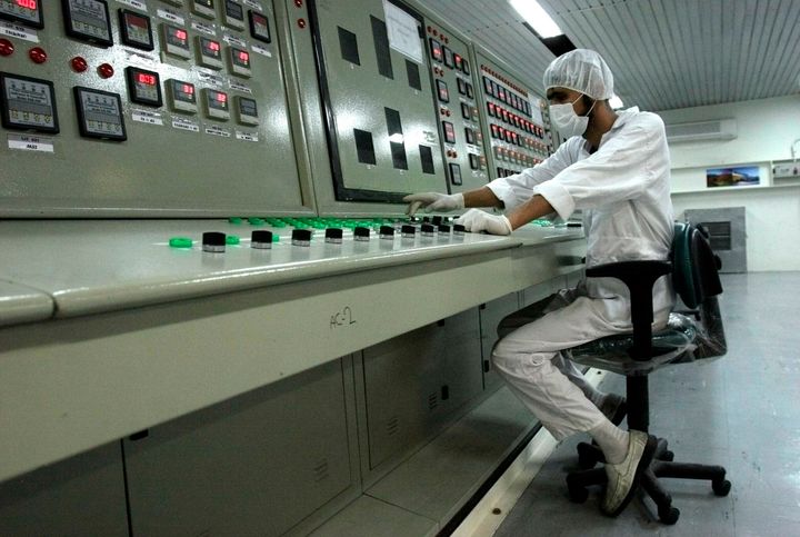 In this 2007 file photo, an Iranian technician works at the Uranium Conversion Facility just outside the city of Isfahan, Iran, 255 miles (410 kilometers) south of the capital Tehran