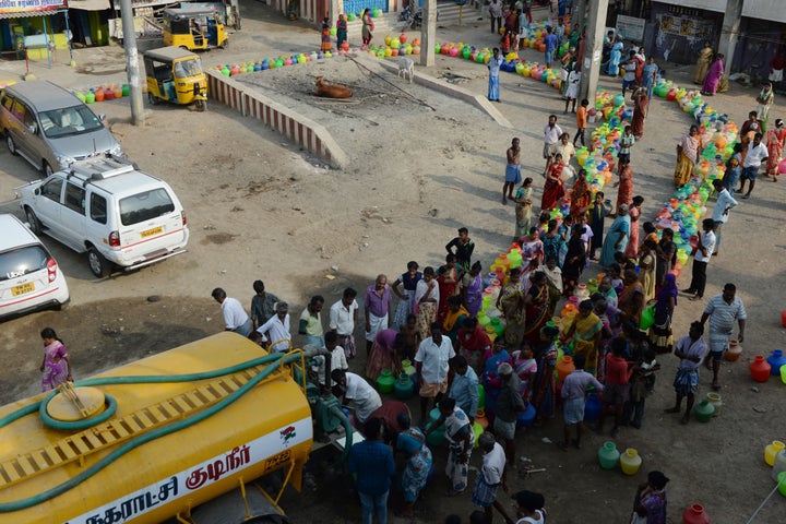 People queue to get drinking water from a tanker on the outskirts of Chennai.