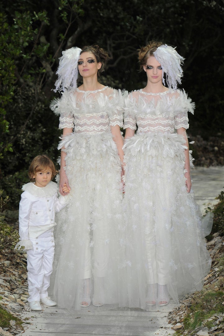 Models Ashleigh Good and Kati Nescher close the spring 2013 Chanel couture show in Paris. 