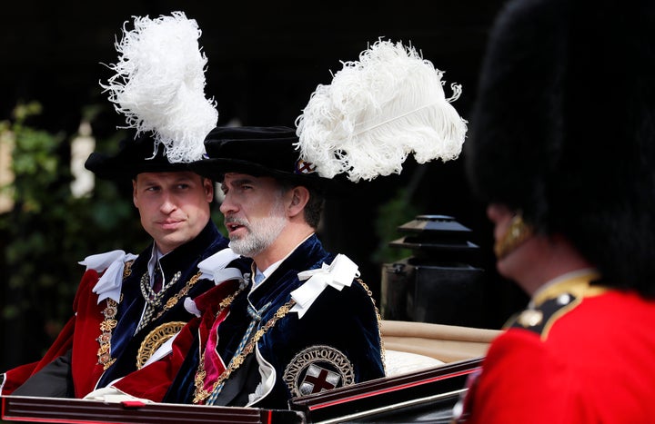 Prince William and Spain's King Felipe sit in a carriage after the Order of the Garter service.