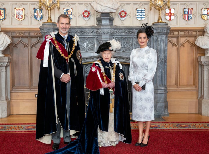 Queen Elizabeth poses for a picture with Spain's King Felipe VI and Queen Letizia in St. George's Hall on June 17 after the king was invested as a supernumerary Knight of the Garter as well.